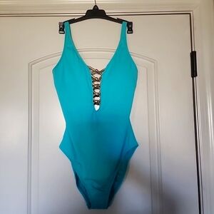 vate your poolside look with this stunning one-piece swimsuit from Bleu Rod Beat